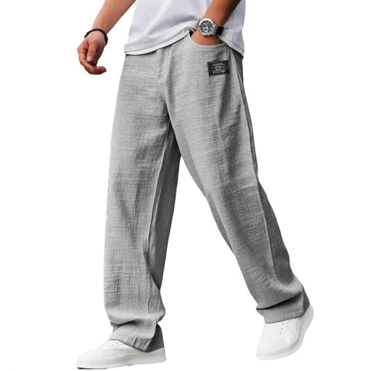 Pantalon Noren gris, coupe ample portée de face